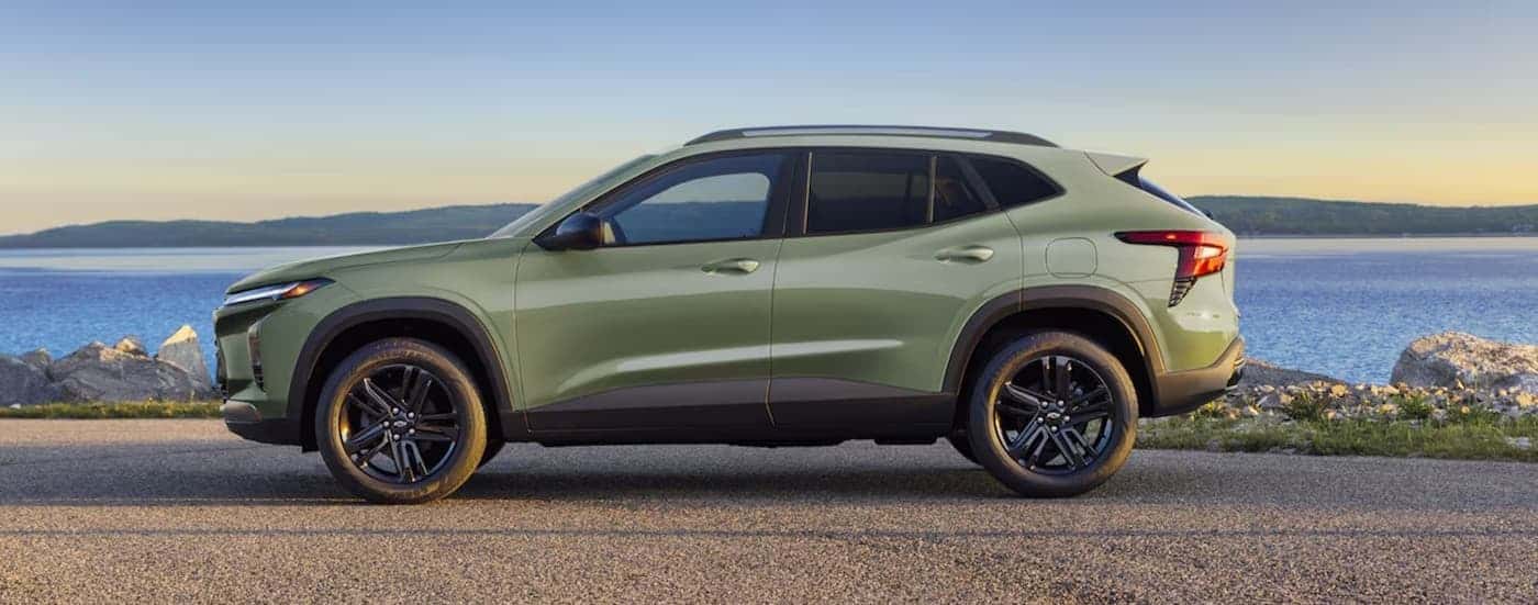 A green 2025 Chevy Trax ACTIV parked near water.