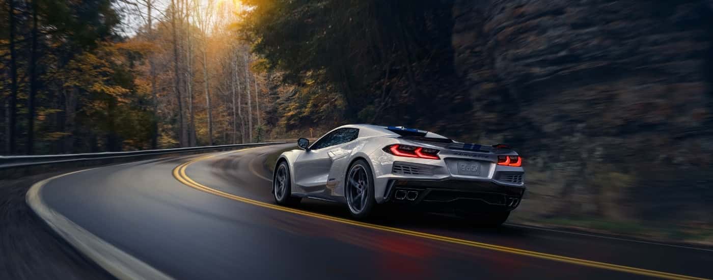 A silver 2026 Chevy Corvette from the rear at an angle.