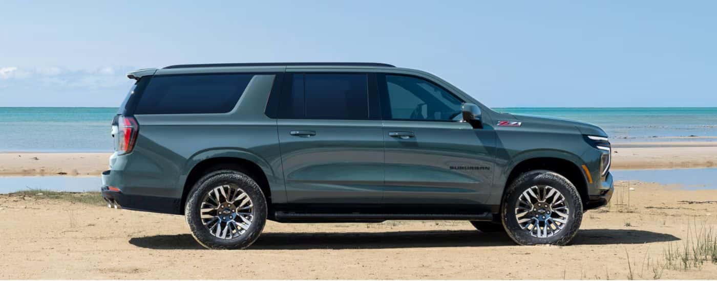 Green 2026 Chevy Suburban parked near the ocean
