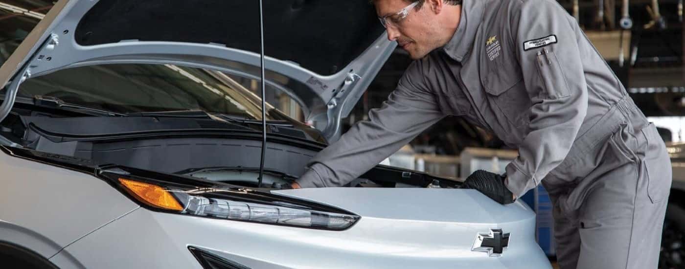 A technician working on a 2023 Chevy Bolt.