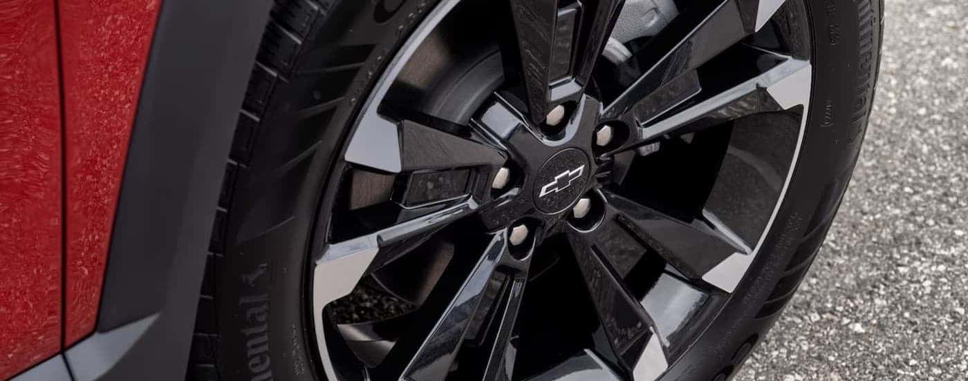 Close-up of a wheel on a red 2025 Chevy Equinox RS.