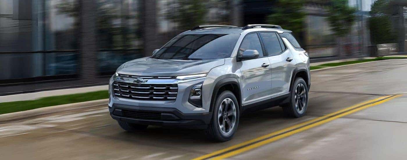 Silver 2026 Chevy Equinox driving through a city