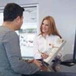 Service customer support member going over a service checklist with a customer