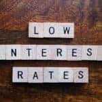 white blocks that spell out low interest rates in three rows
