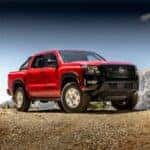 red 2024 nissan frontier hardbody edition parked at an angle