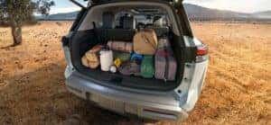 2024 nissan pathfinder cargo area with camping gear and a lightbox in the trunk