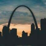 sunset behind the st louis arch