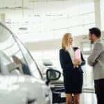 man buying car at dealership
