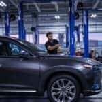 Mazda service technician installing wipers