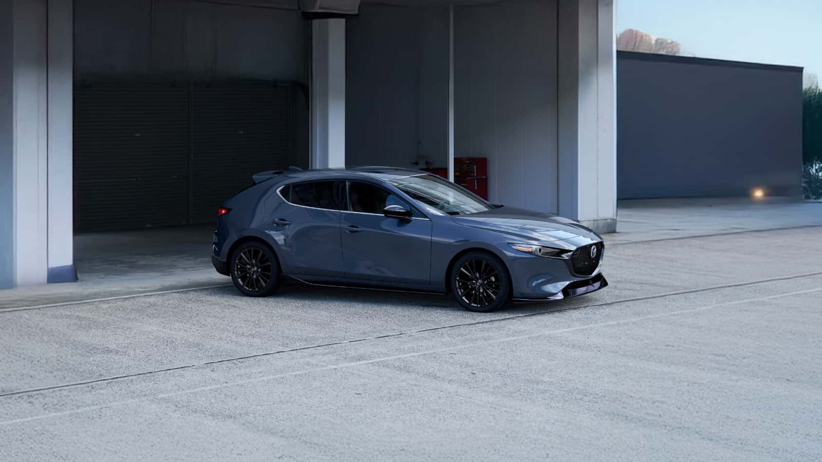 2026 Mazda3 Hatchback pulling out of a parking space