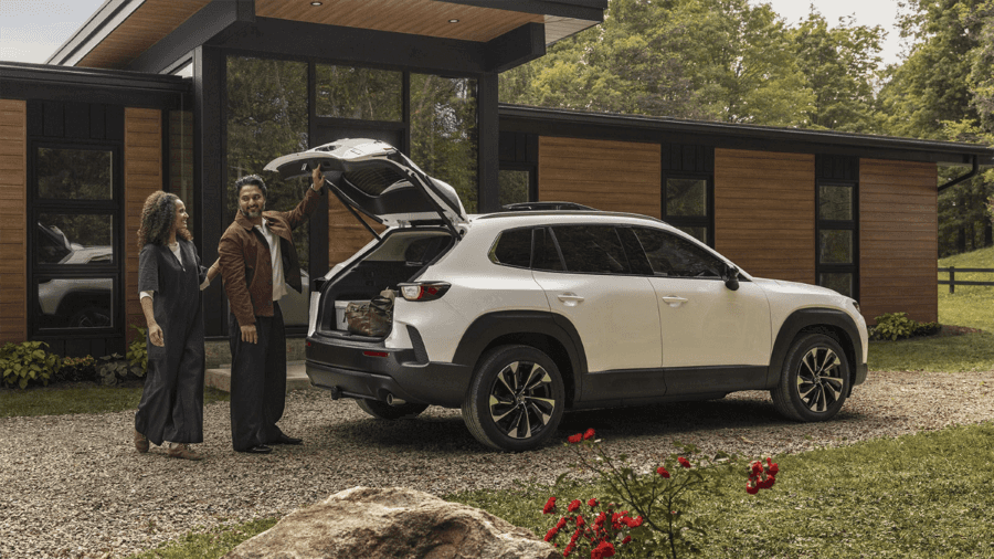 2026 Mazda CX-50 hybrid with people loading rear cargo