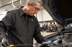 Man Checking Oil level - Mazda Oil Change