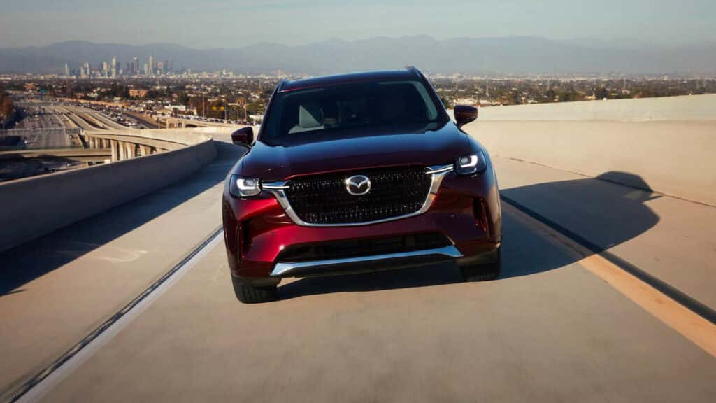 Mazda SUV driving on the road