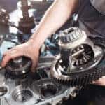Mazda service technician working on a transmission