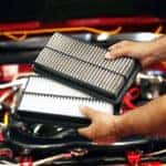 Inspecting engine air filter as part of a Mazda service schedule