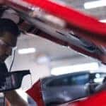 Mazda technician performing a synthetic oil change