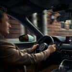 Person driving vehicle equipped with Mazda safety features
