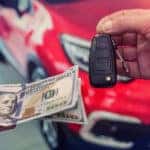 Exchanging cash and keys as part of a Mazda trade-in