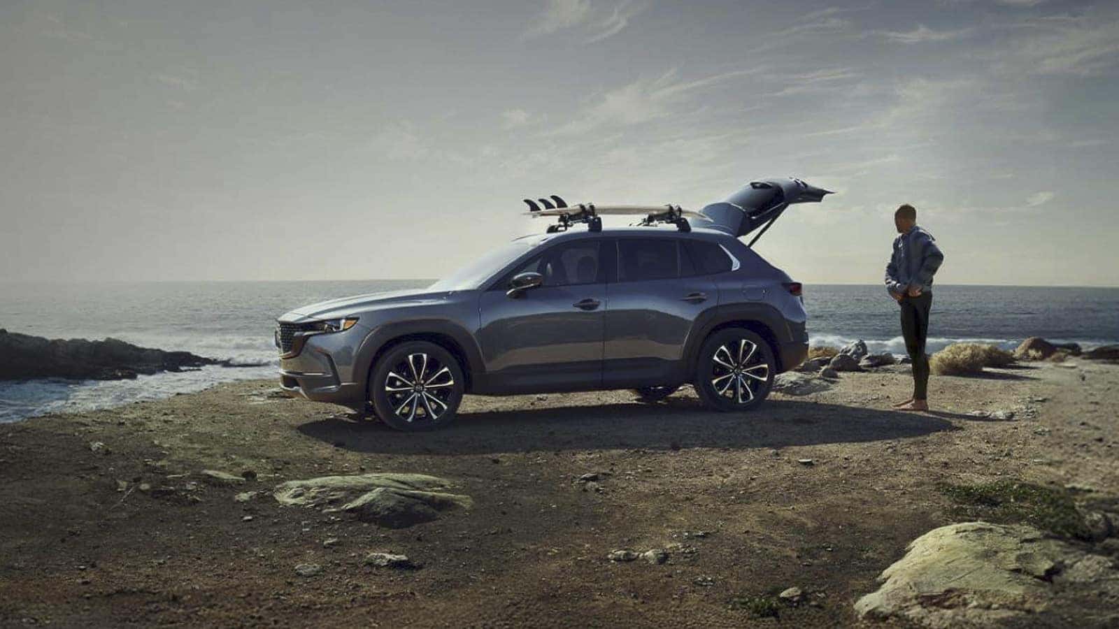 2026 Mazda CX-50 parked near a cliff on rugged terrain