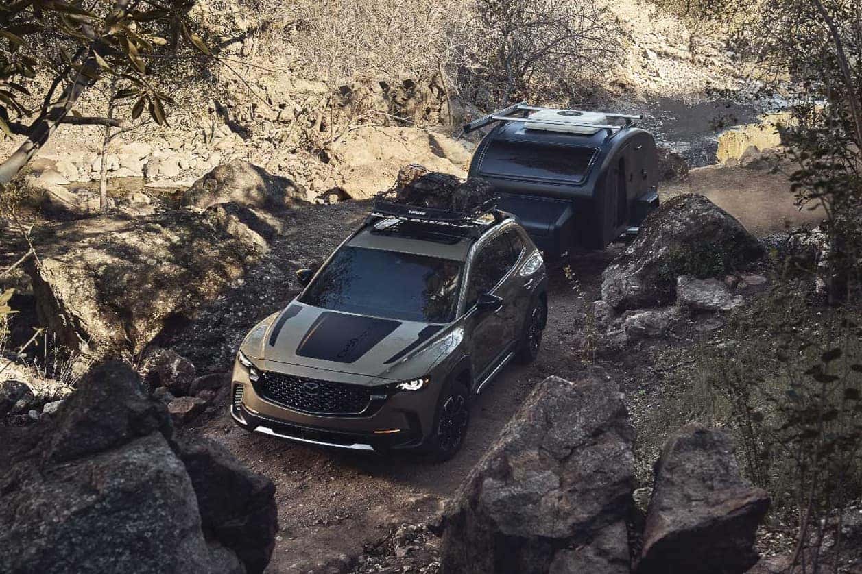 2026 Mazda CX-50 Hybrid towing a small trailer for a weekend trip