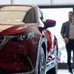 Customer speaking with salesperson about a Mazda lease