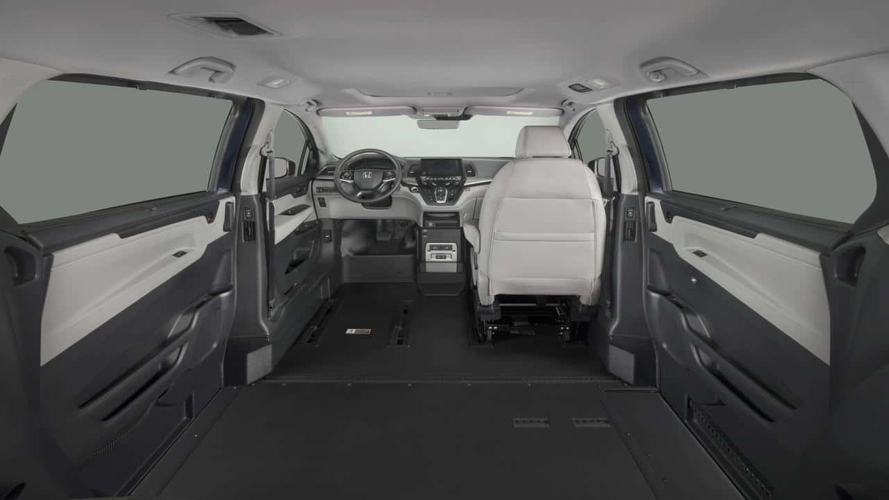 Interior of a wheelchair accessible van showing tie-downs and docking equipment