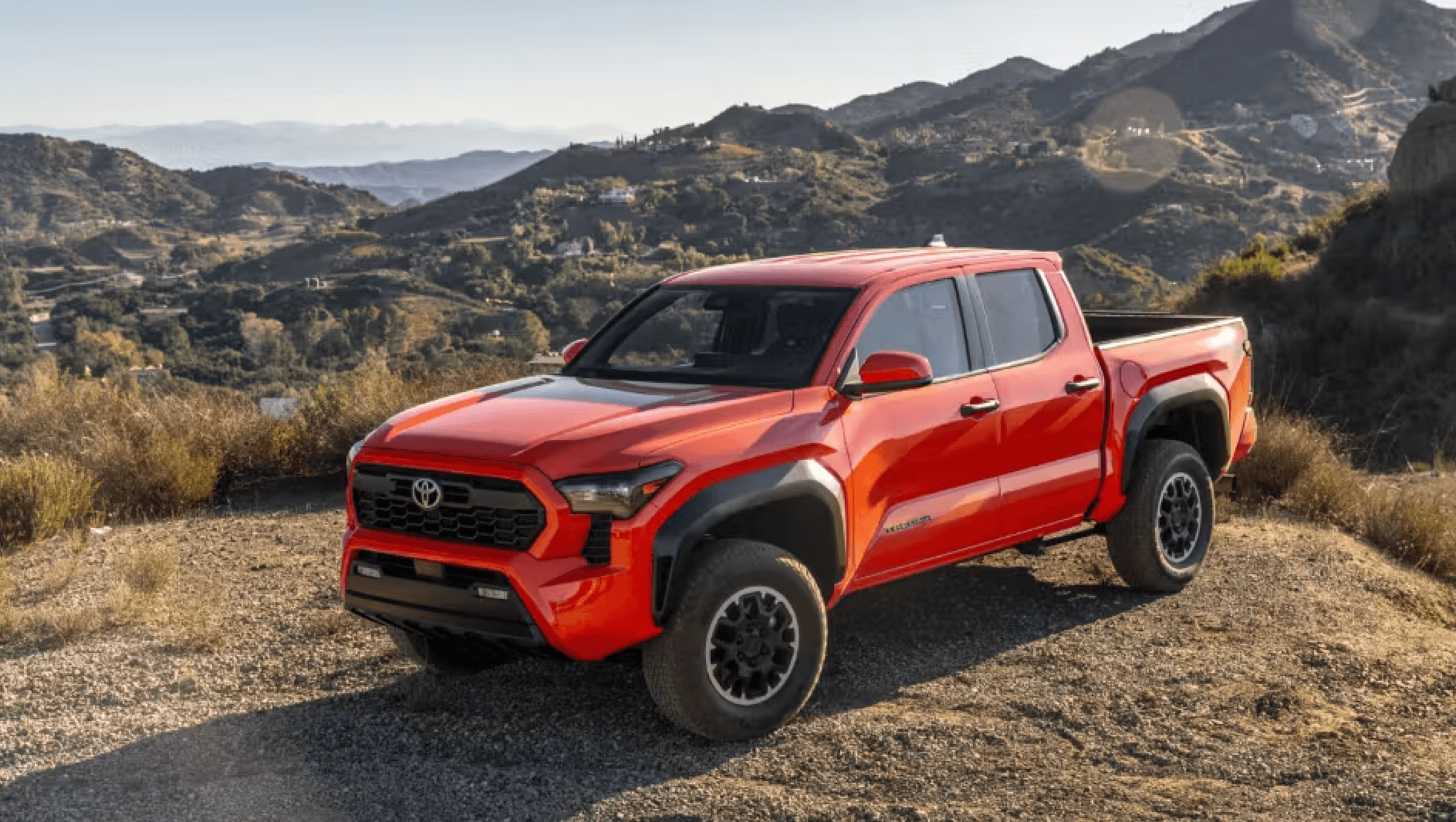 2024 Toyota Tacoma orange pickup truck