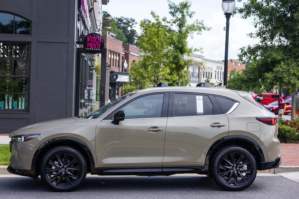 Mazda CX5 vs Chevy Equinox Mazda CX5 side profile outside of Roxy Moxy