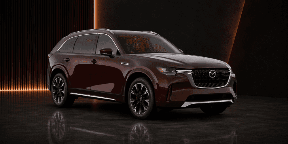 2026 Mazda CX-90 three-row SUV in artisan red studio setting