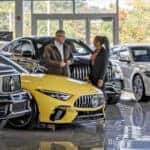 Benzel-Busch salesman showing a Mercedes-Benz vehicle to a customer - Stress-free car buying