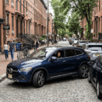 Mercedes-Benz compact SUV navigating narrow Hoboken street, luxury urban driving - parking in hoboken car size · best car