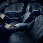 Quiet interior of a 2026 Mercedes-Benz featuring massaging seats and ambient lighting