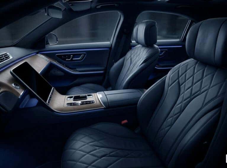 Quiet interior of a 2026 Mercedes-Benz featuring massaging seats and ambient lighting