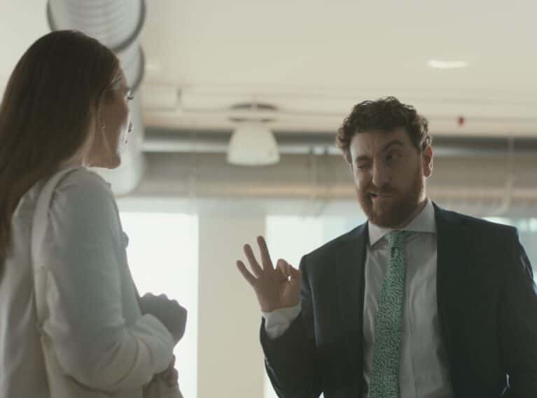 A sleazy salesman at a competing dealership highlighting the typical experience at other dealerships vs. Benzel-Busch - Still from Benzel-Busch Back Room Commercial
