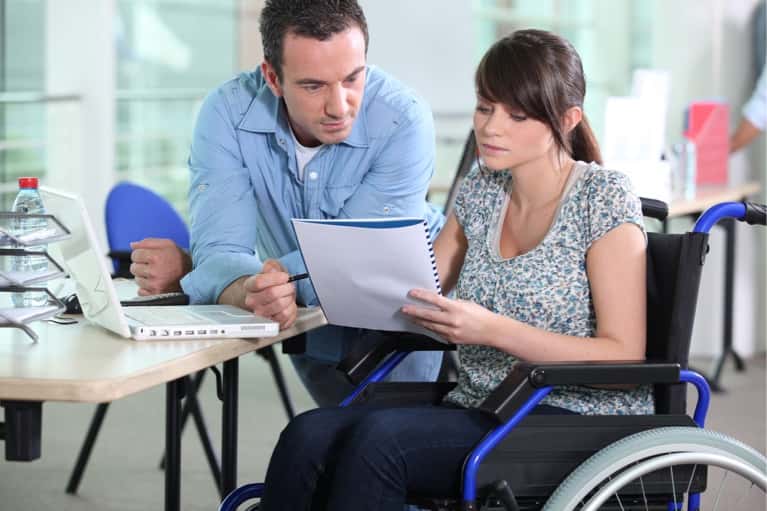 man with woman in wheelchair