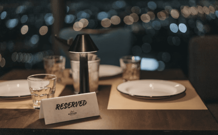 Reserved fine dining table with evening city view