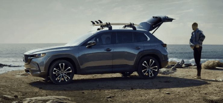2026 Mazda CX-50 parked by the ocean with rear hatch open