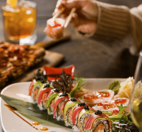 Sushi roll served with chopsticks at restaurant