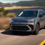 Volkswagen Taos driving on scenic mountain road
