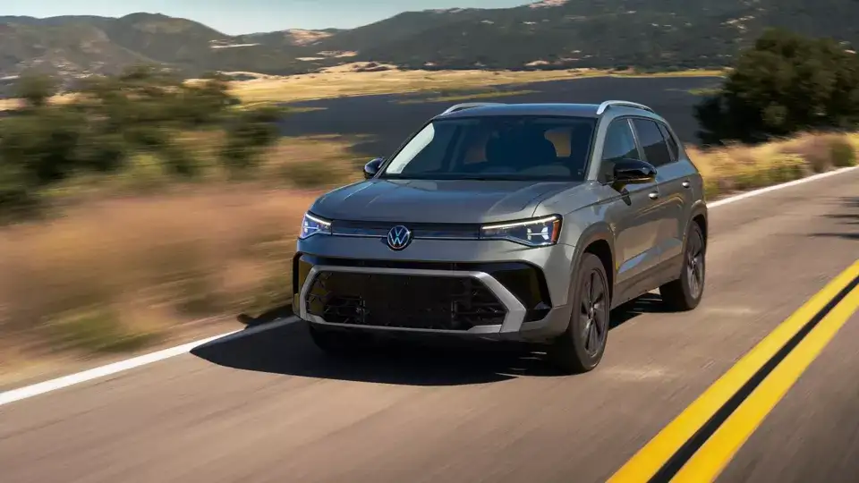 Volkswagen Taos driving on scenic mountain road
