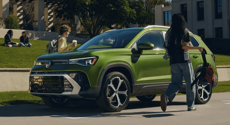 2027 Volkswagen Taos parked on campus as students walk nearby