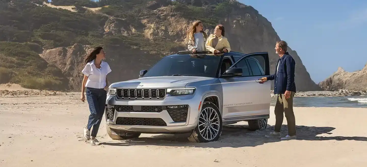 Jeep Grand Cherokee parked on a cliff