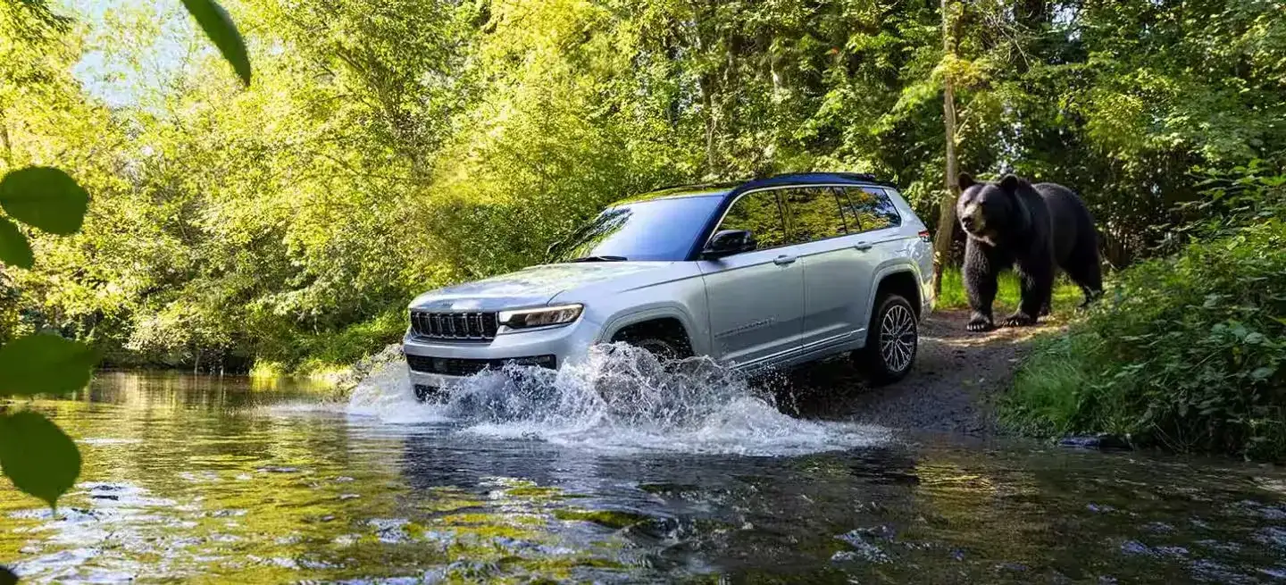 Jeep Grand Cherokee driving on a trail