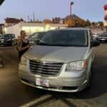 customer next to their new mini van at carhop of appleton