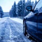 car in the winter driving in the snow