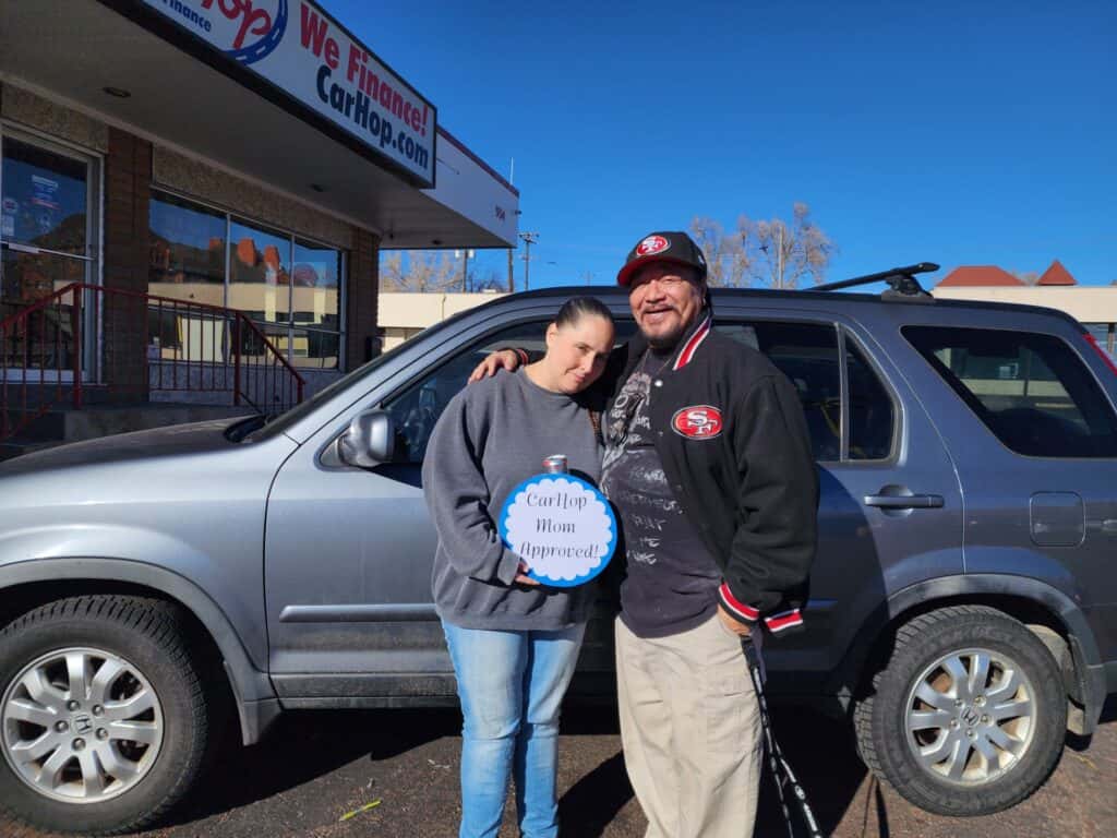 customers with their suv at carhop