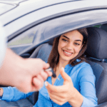 customer getting keys handed to them at a dealership