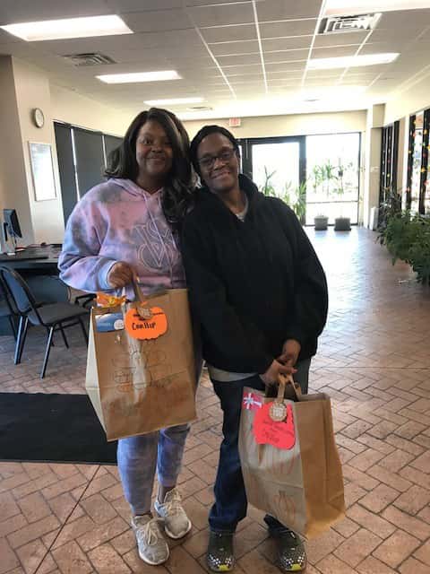 The CarHop of Lincoln, Nebraska team preparing and assembling Thanksgiving meal packages for customers as part of the 2023 CarHop Cares initiative