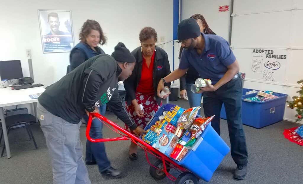 carhop cares omaha with basket of food to give out to customers
