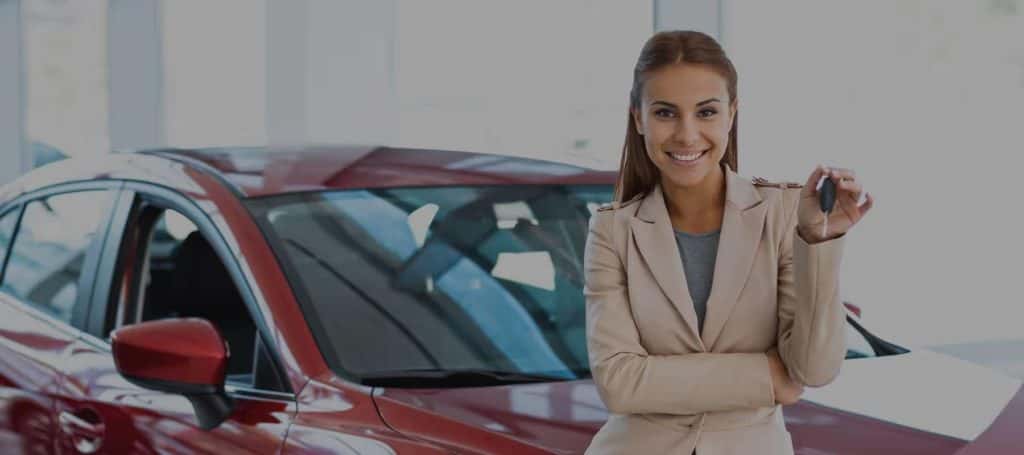 Sales Rep in front of car